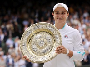 Ashleigh Barty of Australia holds the Venus Rosewater Dish trophy after winning her Ladies' Singles Final match against Karolina Pliskova of The Czech Republic at the Wimbledon tennis championships in London, U.K., on July 10, 2021.