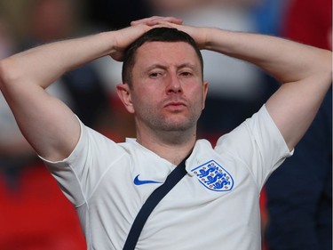 A fan of England looks dejected following defeat in the UEFA Euro 2020 Championship Final between Italy and England at Wembley Stadium on July 11, 2021 in London, England.