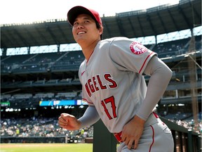 Shohei Ohtani of the Los Angeles Angels takes the field for warm ups before the game against the Seattle Mariners at T-Mobile Park on July 11, 2021 in Seattle, Washington.