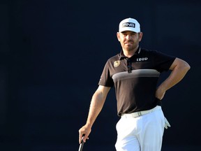 Louis Oosthuizen of South Africa waits on the 18th green during the second round the 149th British Open at Royal St George’s Golf Club in Sandwich, U.K., on July 16, 2021.