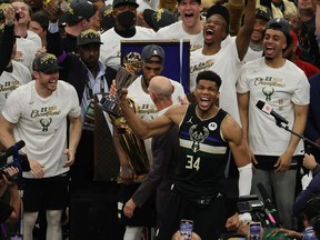 Giannis Antetokounmpo of the Milwaukee Bucks celebrates winning the Bill Russell NBA Finals MVP Award after defeating the Phoenix Suns in Game Six to win the 2021 NBA Finals at Fiserv Forum on July 20, 2021 in Milwaukee, Wisconsin.