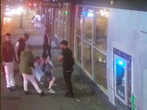 This is a screen grab of a video. Vancouver police are looking to identify the men in the video after a group attacked a man on Granville Street earlier this month.