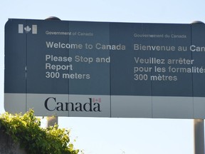 Sign facing northbound vehicles as they enter Canada from the Ogdensburg-Prescott International Bridge in Johnstown.