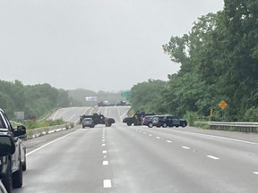 Massachusetts State Police vehicles block Route 95 after an armed standoff between eight to 10 militia members and police forced the closure of the U.S. interstate highway, in Wakefield, Mass., July 3, 2021.