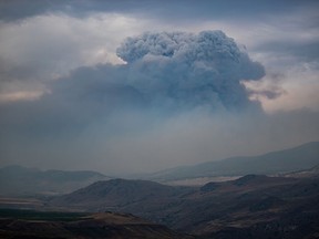 A pyrocumulus cloud, also known as a fire cloud, forms in the sky as the Tremont Creek wildfire burns on the mountains above Ashcroft on Friday, July 16, 2021. Darryl Dyck