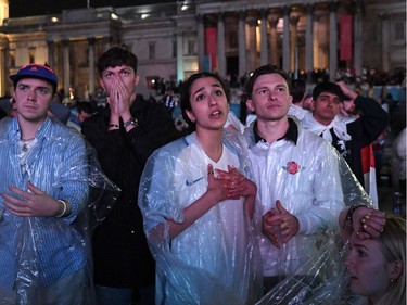 England supporters react after England lose the penalty shoot-out after watching the UEFA EURO 2020 final football match between England and Italy at the fan zone in central London on July 11, 2021.