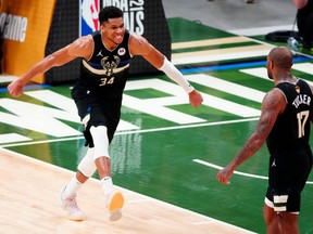 Milwaukee Bucks forward Giannis Antetokounmpo (34) celebrates during game six of the 2021 NBA Finals against the Phoenix Suns at Fiserv Forum.