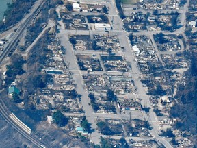 he charred remnants of homes and buildings, destroyed by a wildfire on June 30, are left behind in Lytton.