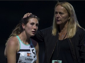 Lindsey Butterworth of Canada is comforted by her coach, Brit Townsend, after the women's 800 metre race during the Harry Jerome International Track Classic in Burnaby on June 20, 2019.