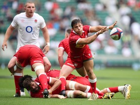 Canada scrum half Ross Braude delivers the ball out of a ruck at Twickenham Stadium in London, U.K., on July 10, 2021. Hosts England thumped Canada 70-14.