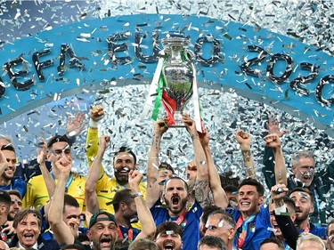 Italy celebrate with the trophy after winning Euro 2020
