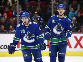 Vancouver Canucks Quinn Hughes and Elias Pettersson skate up ice during their NHL game against the New York Islanders at Rogers Arena March 10, 2020.