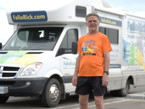 Rick Fall stands near his RV in Regina, Saskatchewan on June 4, 2021. Fall is running across Canada to raise money for Make-A-Wish Canada and Childhood Cancer Canada.
