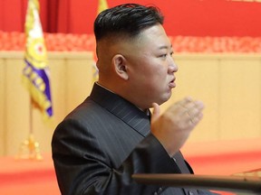 This undated picture released from North Korea's official Korean Central News Agency (KCNA) on July 30, 2021 shows North Korean leader Kim Jong Un taking part in the First Workshop of KPA Commanders and Political Officers, at April 25 House of Culture in Pyongyang.