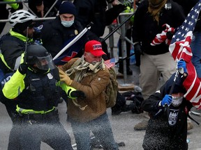 Pro-Trump protesters storm into the U.S. Capitol during clashes with police in Washington January 6, 2021.