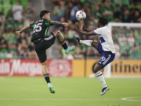 Austin FC’s Sebastian Driussi and Vancouver Whitecap Janio Bikel vie for the ball during the teams’ Aug. 18 MLS match in Texas. Bikel is in the mix for a left-back spot on Saturday at B.C. Place.