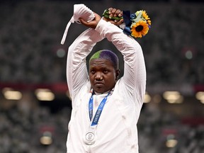 American Raven Saunders gestures while on the podium after winning silver in the women't shot put event this past weekend at the Tokyo Olympics.