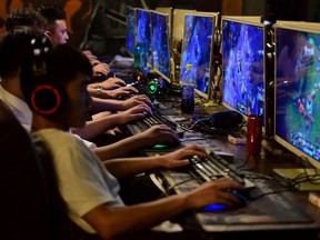 People play online games at an internet cafe in Fuyang, Anhui province, China August 20, 2018.