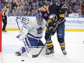 Toronto Maple Leafs goaltender Frederik Andersen (31) looks to make a save on Buffalo Sabres center Curtis Lazar (27) during the second period at KeyBank Center.