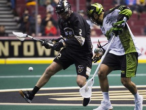 Vancouver Warriors Matt Beers (left) and Saskatchewan Rush Jeremy Thompson look for a loose ball in a regular season NLL lacrosse game at Rogers Arena, Vancouver, Jan. 12, 2019.