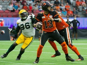 B.C. Lions QB Michael Reilly drops back to throw against the Edmonton Elks in CFL action at B.C. Place in Vancouver on Thursday, Aug. 19, 2021.