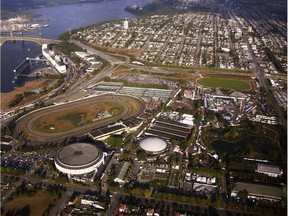 An aerial photo in 2002 showing Hastings Park Racetrack, the Pacific Coliseum, centre, the Iron Workers Memorial Bridge, left, the PNE grounds, right, all in Vancouver, and the residential area in north Burnaby, top.