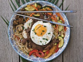 Bibimbap, a staple of Korean cuisine, is a riot of colour and flavour.