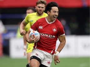 Nathan Hirayama of Canada smiles as he breaks away during their semifinal rugby sevens match against Australia at B.C. Place Stadium on March 8, 2020.