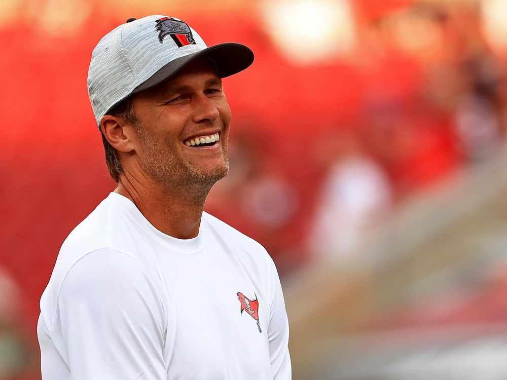  Tom Brady #12 of the Tampa Bay Buccaneers looks on during a preseason game against the Tennessee Titans on August 21, 2021 in Tampa, Florida.