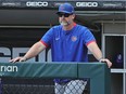 Manager David Ross of the Chicago Cubs watches his team.