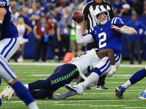 Carson Wentz #2 of the Indianapolis Colts throws the ball away during the fourth quarter against the Seattle Seahawks at Lucas Oil Stadium on September 12, 2021 in Indianapolis, Indiana.