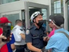 Two people face charges after an anti-vaccine protest at Yonge and Dundas Sts.