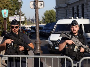 French Gendarmes stand guard outside the Palais de Justice of Paris, on September 8, 2021, ahead of the start of the trial of the November 2015 Paris attacks' defendant.