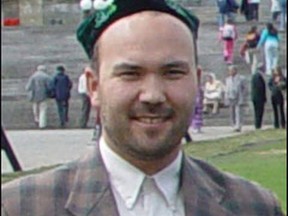 Huseyin Celil standing in front of the Canadian Parliament buildings in Ottawa, May 2005.