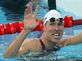 In this file photo taken on August 12, 2008 swimmer Klete Keller smiles after winning the men's 4 x 200m freestyle relay heat at the National Aquatics Center in the 2008 Beijing Olympic Games. Keller, 39, admitted in a plea agreement to breaching the US Capitol to try to obstruct the certification of Democrat Joe Biden's November presidential election victory. (Photo by Greg WOOD / AFP) (Photo by GREG WOOD/AFP via Getty Images)