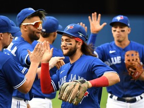 Toronto Blue Jays shortstop Bo Bichette (11) celebrates with teammates after defeating Tampa Bay Rays at Rogers Centre on Sept. 15, 2021.