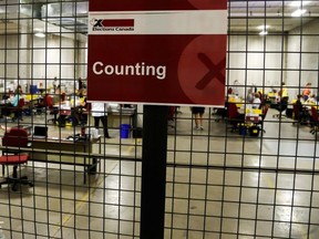 Special ballot officers count ballots from national, international, Canadian Forces and incarcerated electors that were received by mail during the federal election in Ottawa, Ontario, Canada, September 20, 2021.