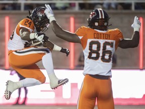 B.C. Lions James Butler (24) runs in for a touchdown during first half CFL football action against the Montreal Alouettes in Montreal, Saturday, September 18, 2021.