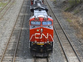 A Canadian National Railway locomotive pulls a train in Montreal, Quebec, Canada, on Tuesday, April 20, 2021.