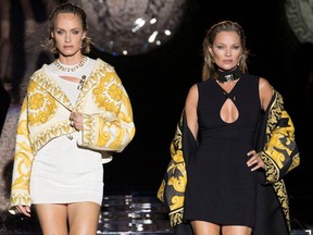 Models Amber Valletta and Kate Moss present creations from the Versace by Fendi collection during Milan Fashion Week in Milan, Italy, September 26, 2021.