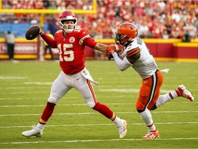 Kansas City Chiefs quarterback Patrick Mahomes (15) throws a pass as Cleveland Browns middle linebacker Anthony Walker (4) defends during the second half at GEHA Field at Arrowhead Stadium. Mandatory Credit: Jay Biggerstaff-USA TODAY Sports
