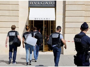 French police stand in front of the Bulgari jewellery store following a robbery at Place Vendome in Paris, France, September 7, 2021.