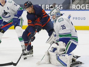 Winger Alex Chiasson, jamming the net against Canucks goalie Thatcher Demko last season, has joined the Canucks on a professional tryout basis. He scored nine goals in 45 games last year for the Edmonton Oilers.