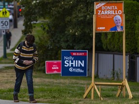 Election signs on Como Lake and Mariner Way in Coquitlam.