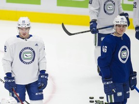 Vasily Podkolzin (left) and Danila Klimovich are both enjoying their first taste of a National Hockey League training camp, as well as ingratiating themselves with their new teammates.