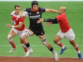 Canada's Jake Thiel breaks through the Great Britain defence in the quarterfinals of the 2021 HSBC Canada Sevens at B.C. Place Stadium on Sunday.