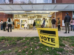 Voters outside Mt. Pleasant Community Centre wait to cast their ballot in the 2021 Federal Election