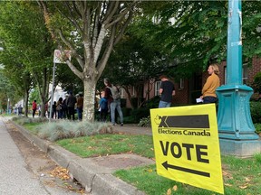 Voters line up around the block at Holy Trinity Ukranian Orthodox Cathedral and Auditorium in Vancouver on Sept. 20, 2021.