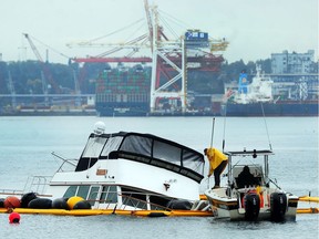 The 54-foot yacht, named the Rockin Chair, ran aground Monday in Coal Harbour near the Nine O'Clock Gun.
