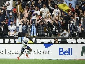 Vancouver Whitecaps FC forward Deiber Caicedo (7) scores against Austin FC goalkeeper Brad Stuver (41) during the second half at B.C. Place during a game in September.